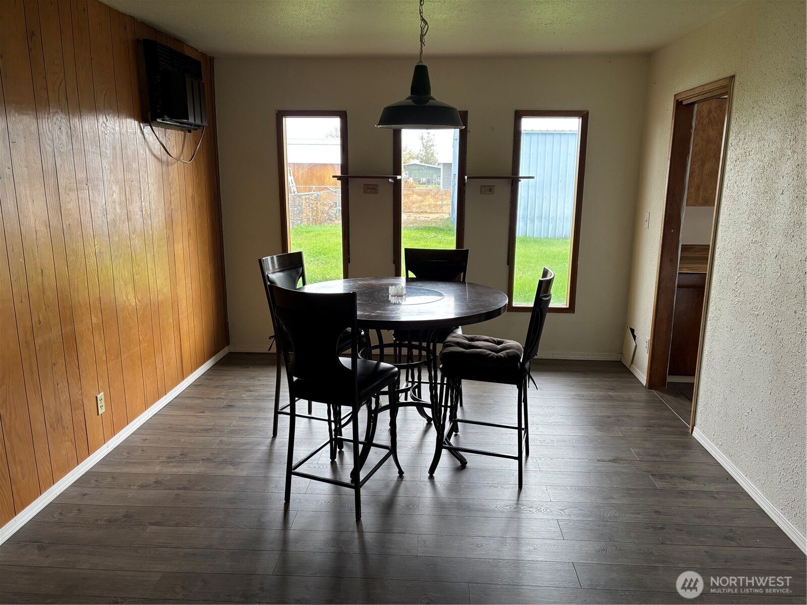 9008 Bong Loop, Unit B Moses Lake, WA 98837 - Photo 19 of 27 a dining room with furniture window wooden floor