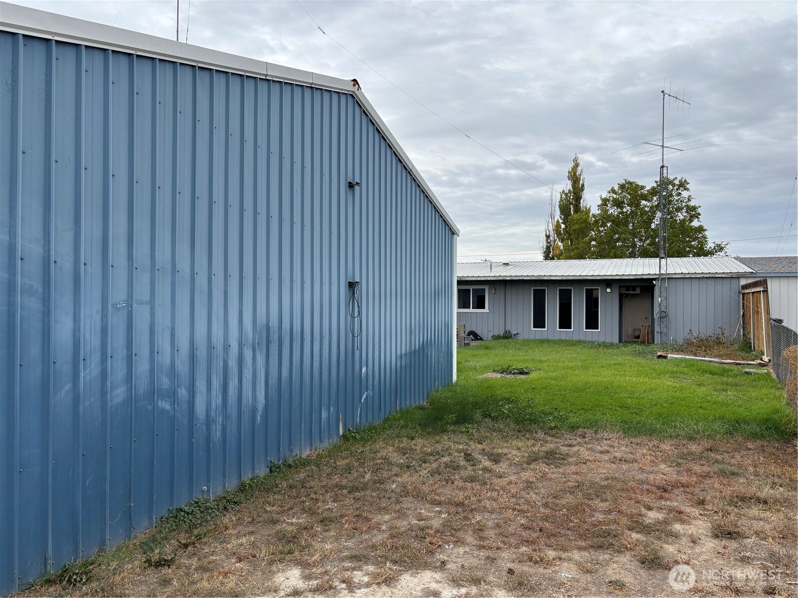 9008 Bong Loop, Unit B Moses Lake, WA 98837 - Photo 25 of 27 a view of a house with a backyard