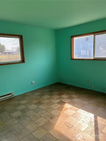 a view of a room with a large window