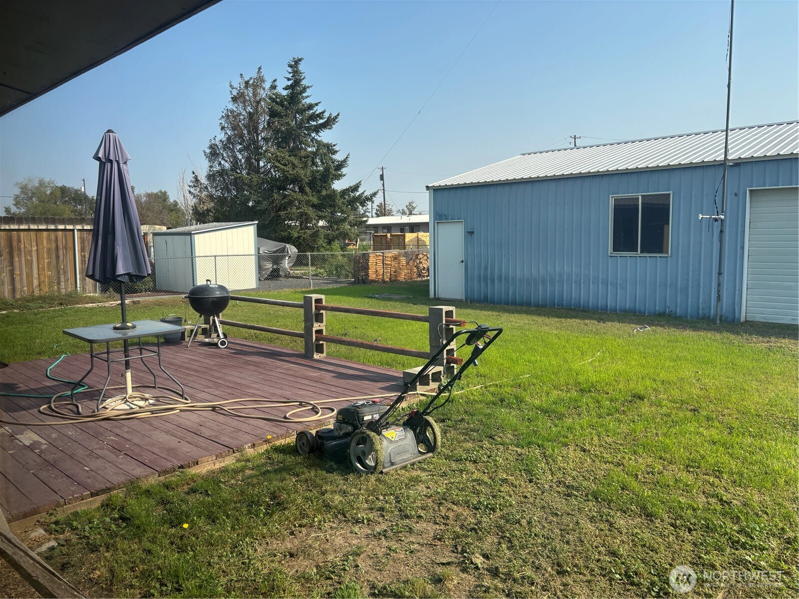 9008 Bong Loop, Unit B Moses Lake, WA 98837 - Photo 10 of 27 a view of a backyard with sitting area