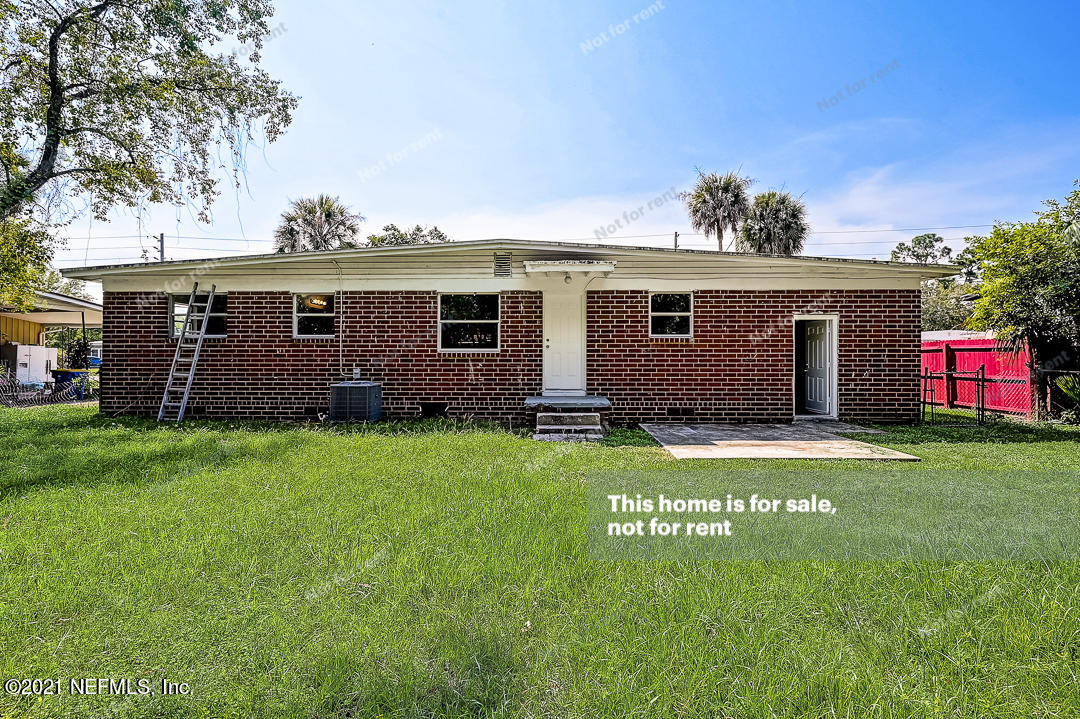 3503 Rogero Road Jacksonville, FL 32277 - Photo 13 of 27 front view of a house with a yard