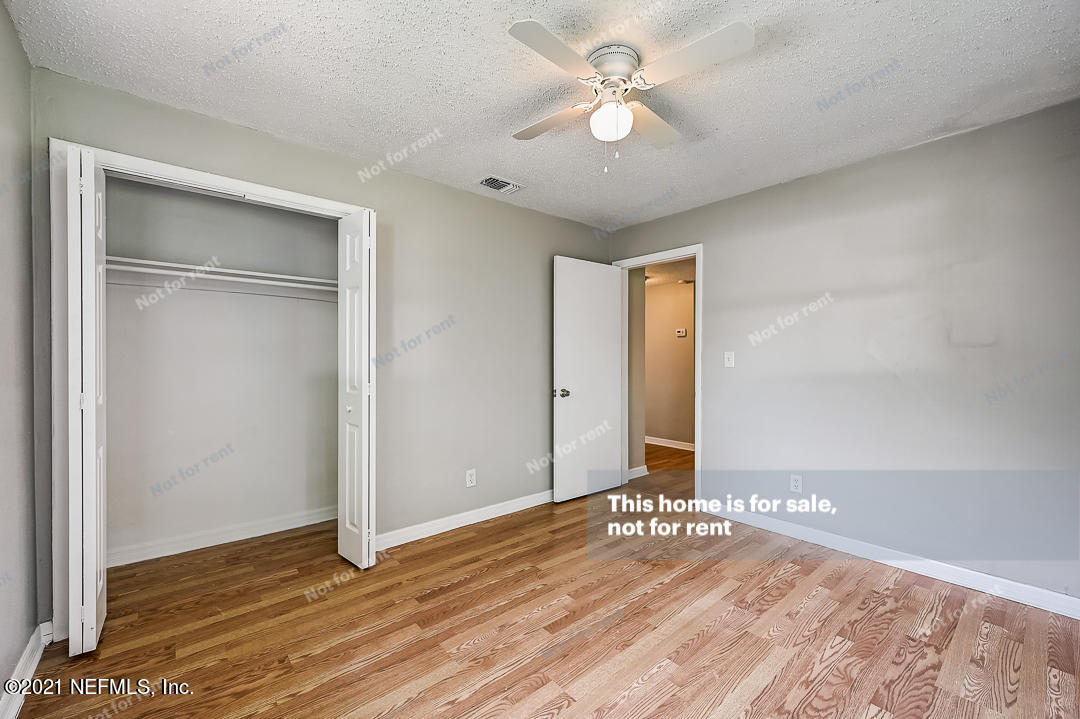 3503 Rogero Road Jacksonville, FL 32277 - Photo 26 of 27 a view of empty room with wooden floor