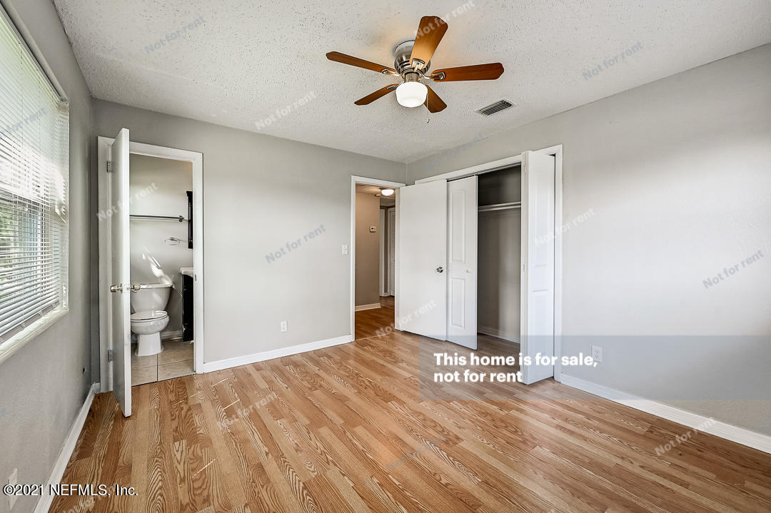 3503 Rogero Road Jacksonville, FL 32277 - Photo 27 of 27 wooden floor in an empty room with a window