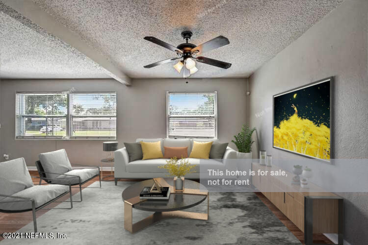 3503 Rogero Road Jacksonville, FL 32277 - Photo 3 of 27 a living room with furniture and a large window