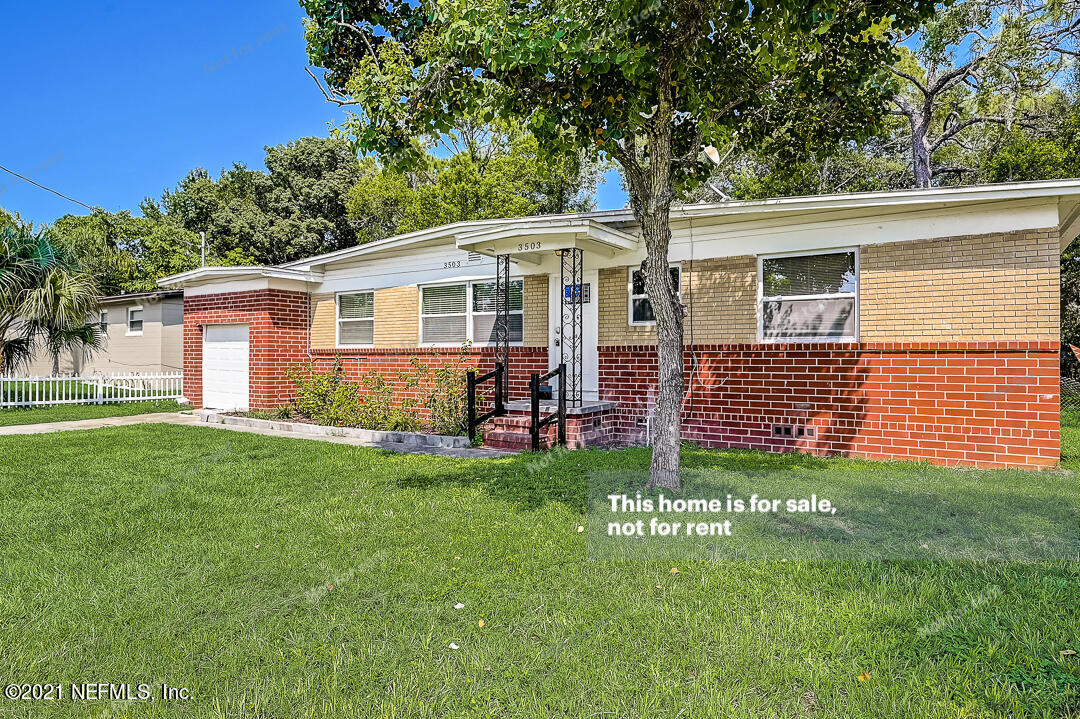 3503 Rogero Road Jacksonville, FL 32277 - Photo 9 of 27 a view of a house with a yard and porch