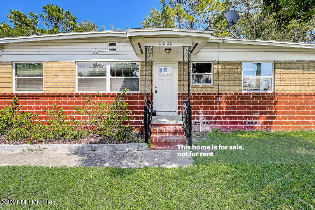 3503 Rogero Road Jacksonville, FL 32277 - Photo 10 of 27 a front view of a house with a yard