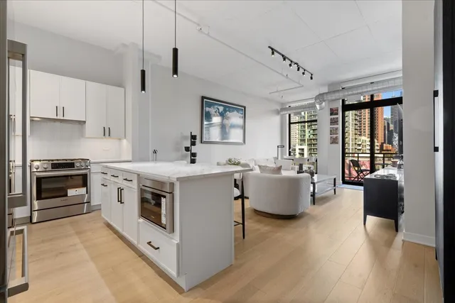 a kitchen with stove and cabinets