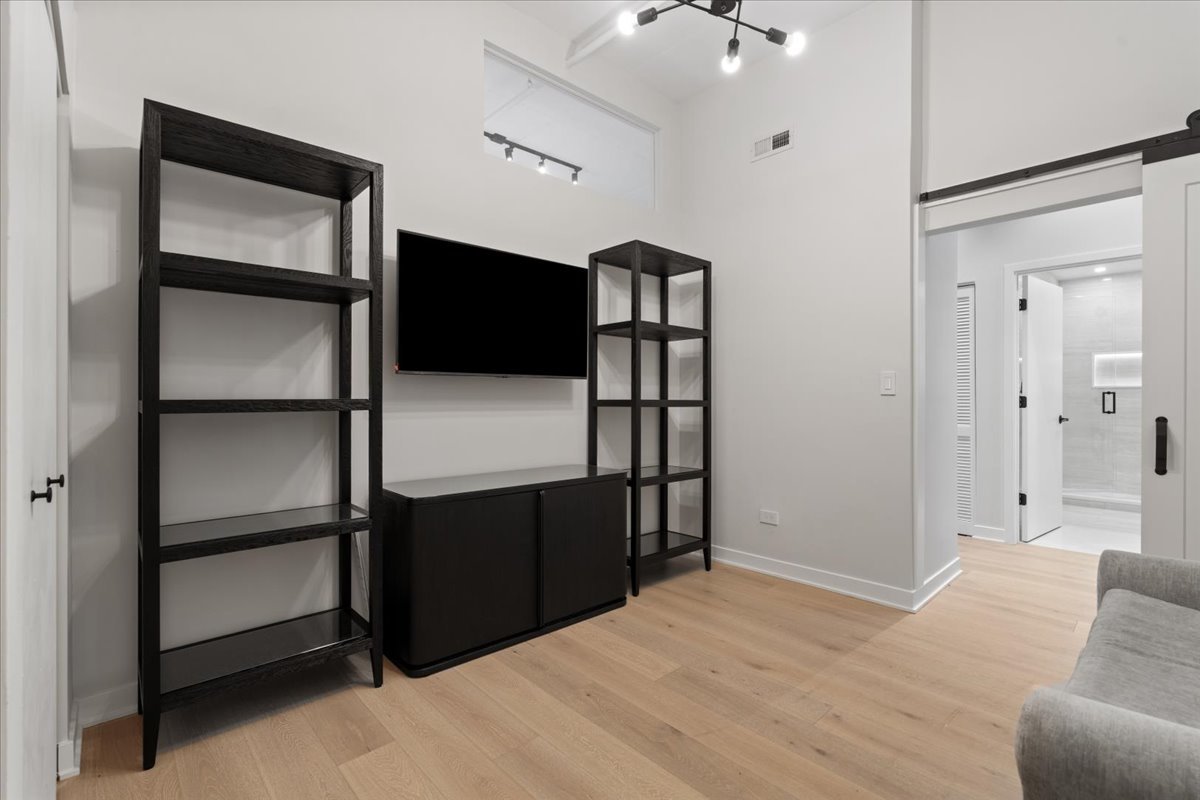 740 West Fulton Street, Unit 507 Chicago, IL 60661 - Photo 21 of 27 a view of empty room with wooden floor