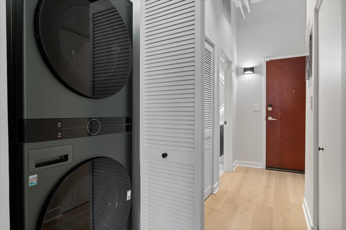 740 West Fulton Street, Unit 507 Chicago, IL 60661 - Photo 23 of 27 a view of a hallway with washer and dryer