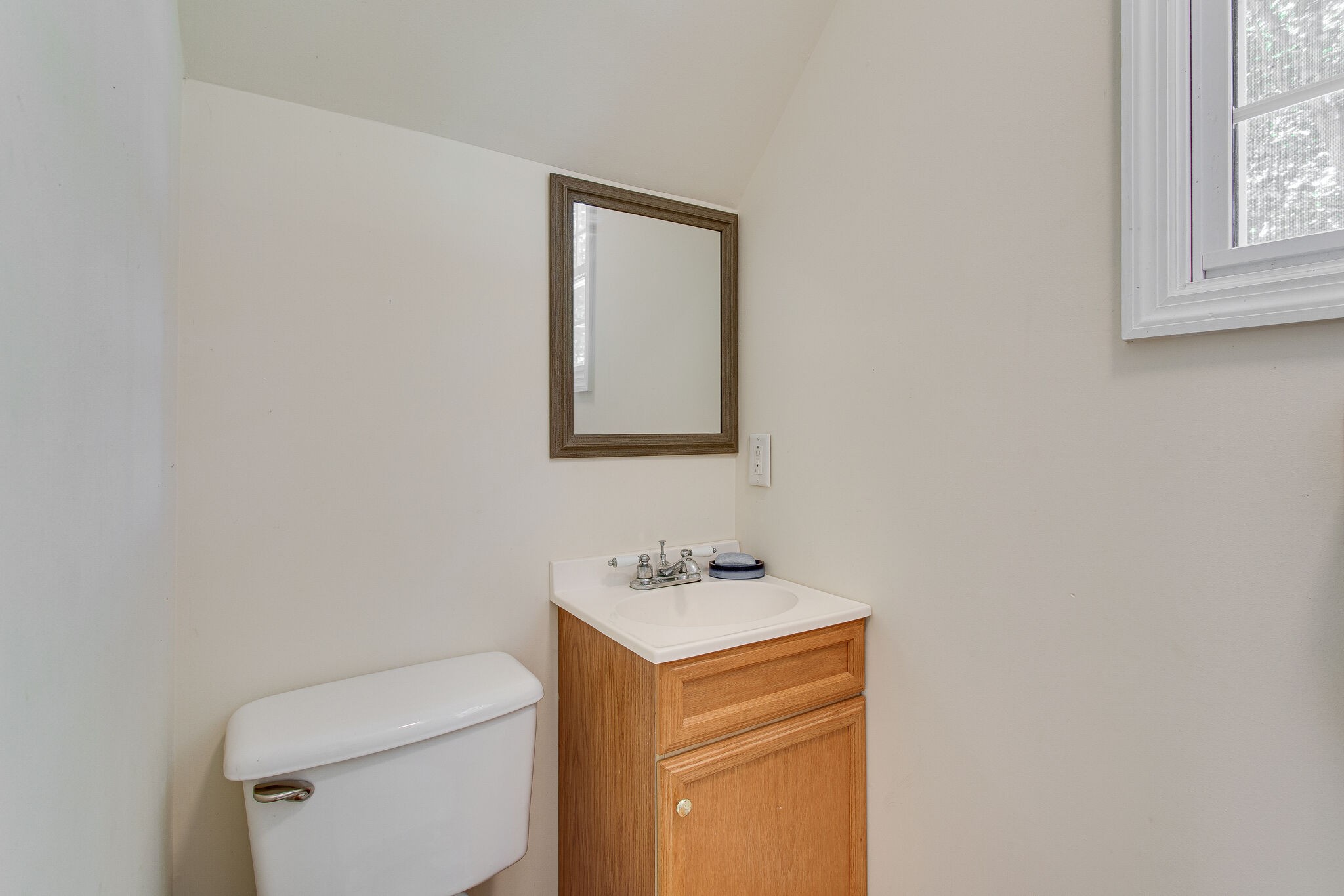 658 Cedar Mountain Place Decherd, TN 37324 - Photo 39 of 53 a bathroom with a toilet sink and mirror