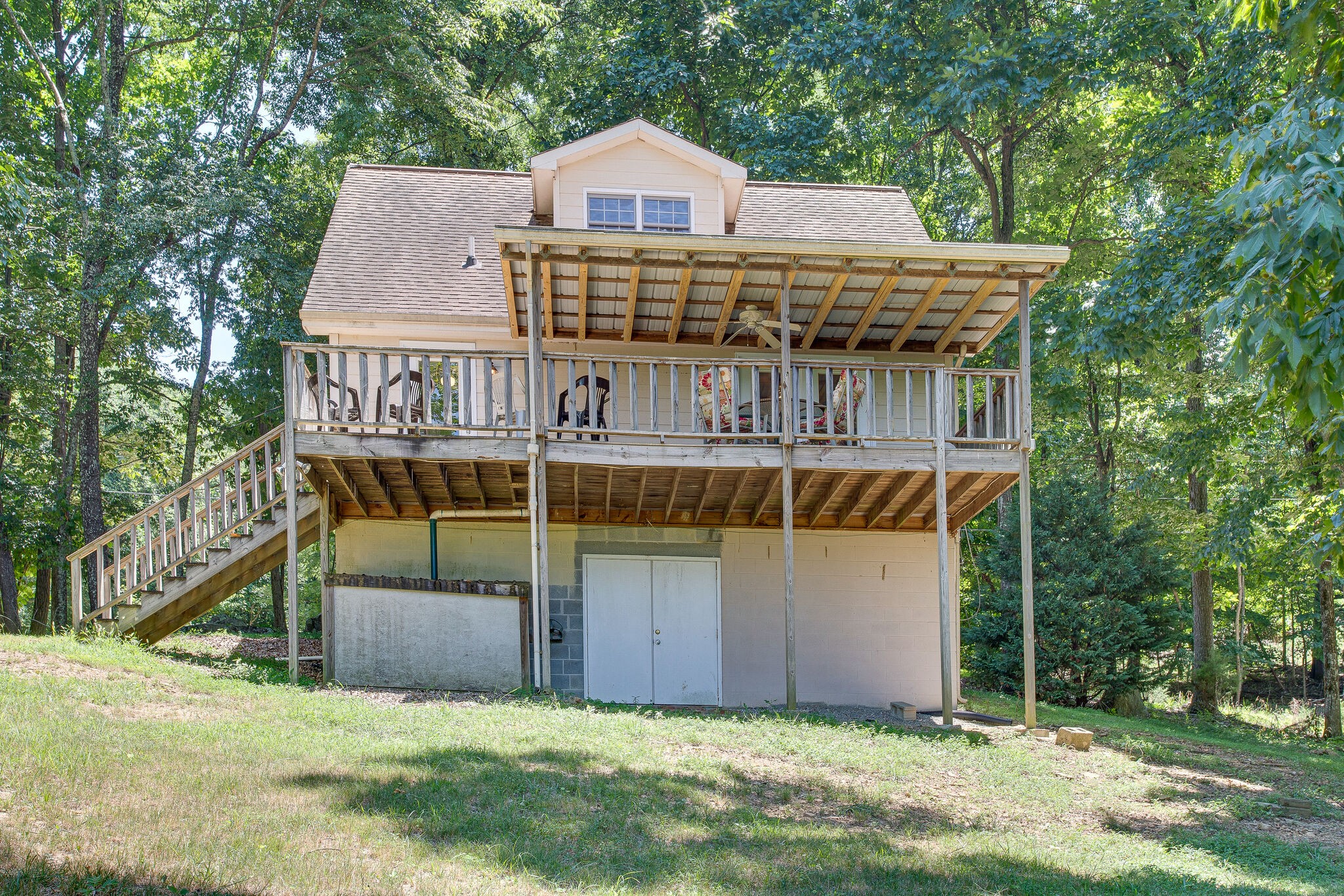 658 Cedar Mountain Place Decherd, TN 37324 - Photo 45 of 53 a view of a house with a yard and deck