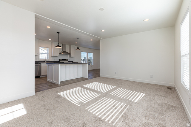 749 Riddle Drive Fredonia, AZ 86022 - Photo 41 of 41 Kitchen with dark countertops, white cabinetry, pendant lighting, a kitchen island, and open floor plan