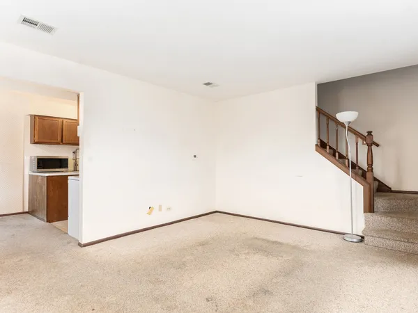 a view of a room with an empty space