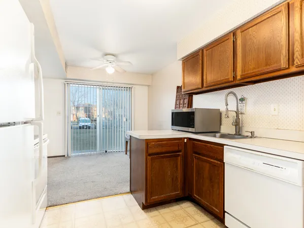 a kitchen with a sink cabinets and appliances