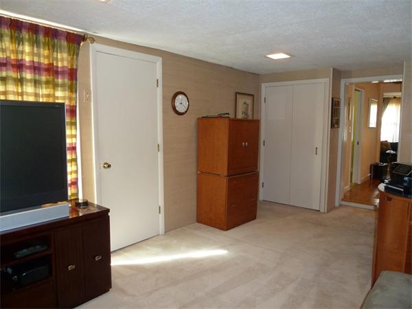 4 Oriole Road Wellesley, MA 02481 - Photo 11 of 14 a view of room with workspace and a flat screen tv