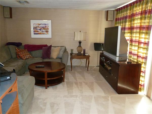 4 Oriole Road Wellesley, MA 02481 - Photo 9 of 14 a living room with furniture a flat screen tv and a wall painting