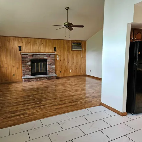 a view of a livingroom with wooden floor
