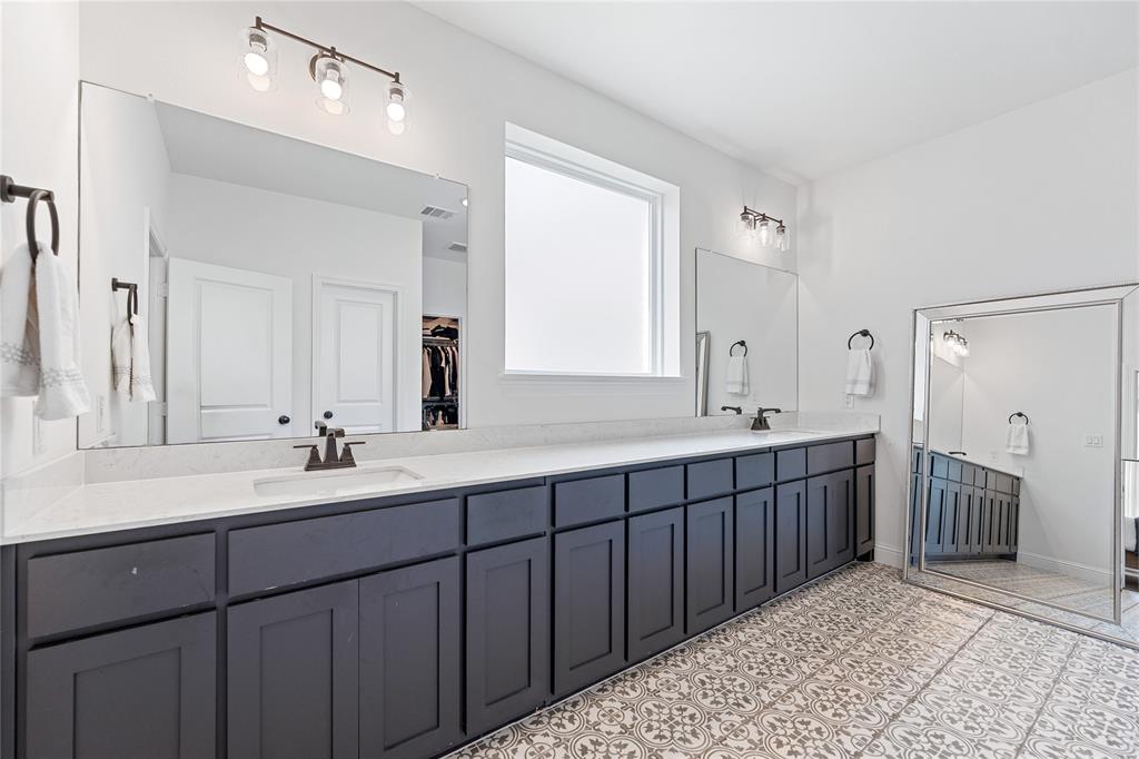 5244 Ranchero Trail Fort Worth, TX 76126 - Photo 16 of 31 Bathroom with double vanity and a spacious closet