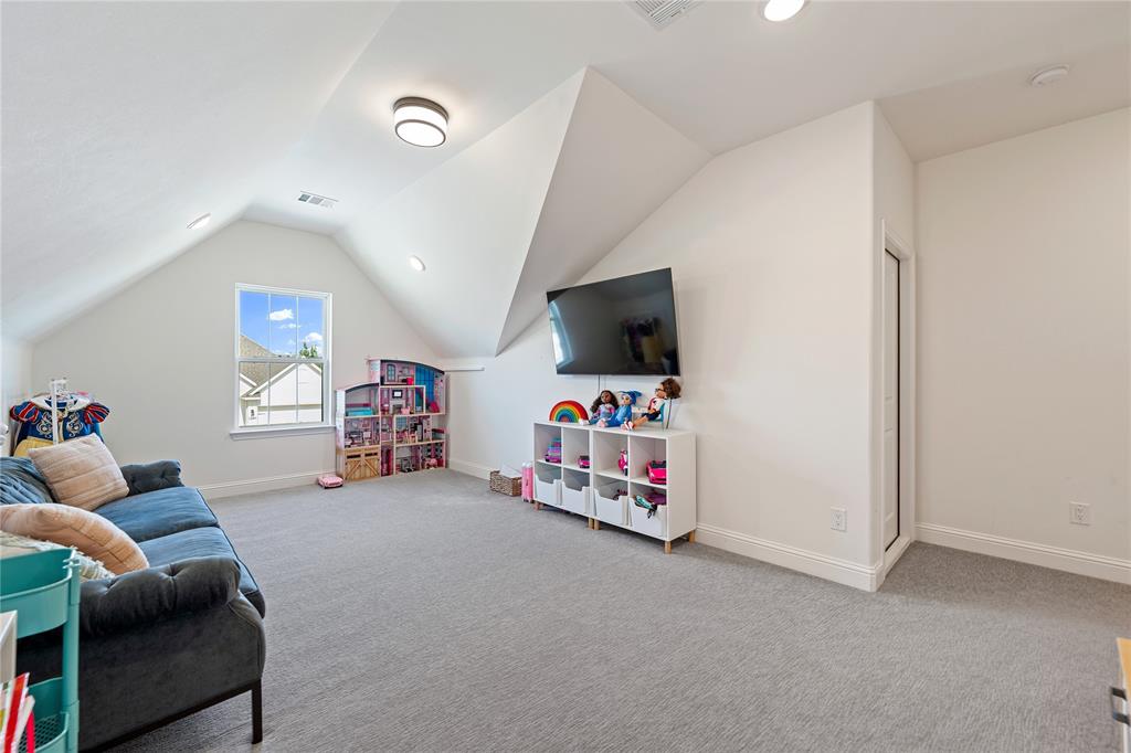 5244 Ranchero Trail Fort Worth, TX 76126 - Photo 25 of 31 Recreation room featuring lofted ceiling, light carpet, and recessed lighting