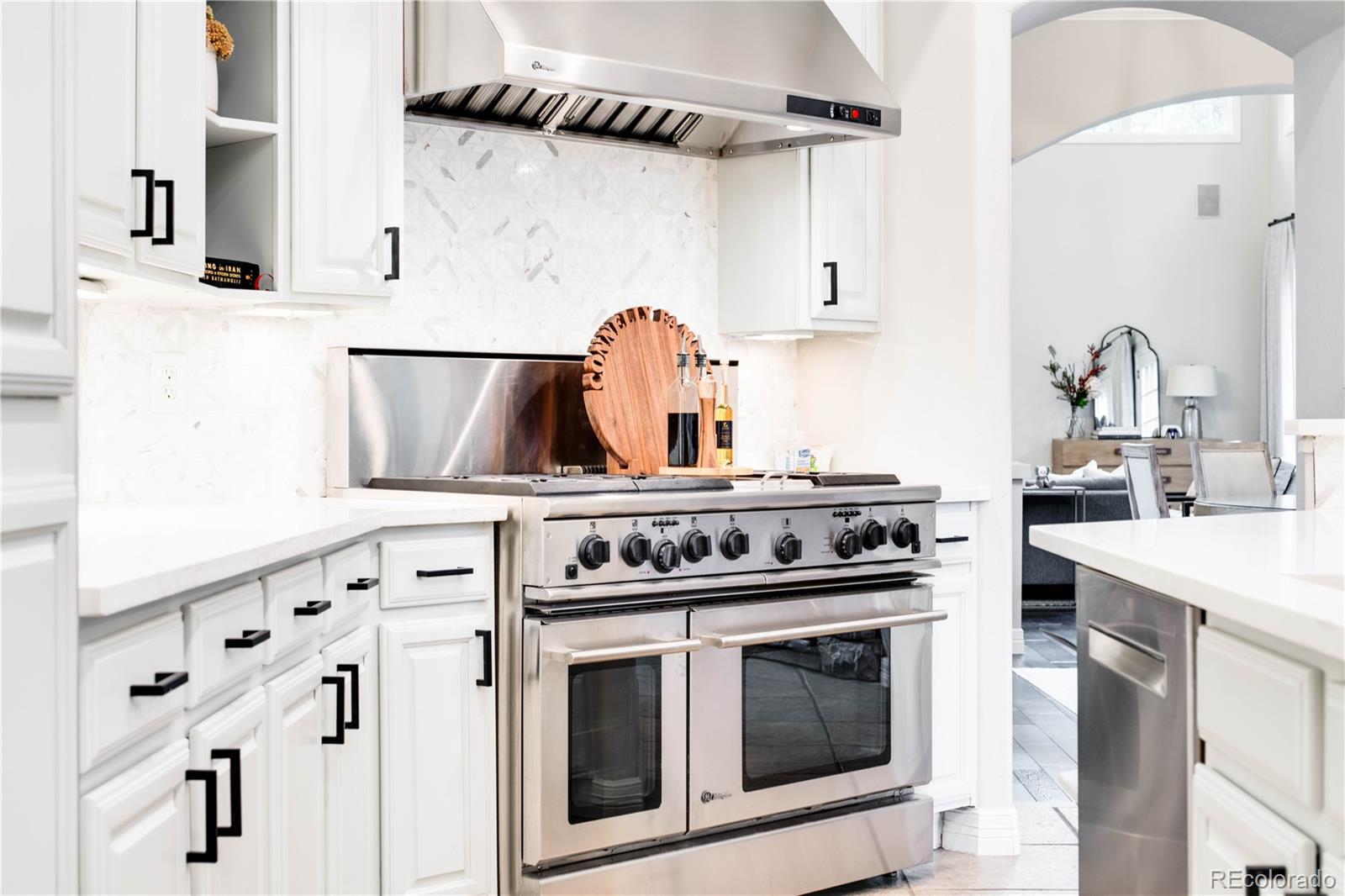 1 Ravenswood Road Cherry Hills Village, CO 80113 - Photo 13 of 40 a stove top oven sitting inside of a kitchen