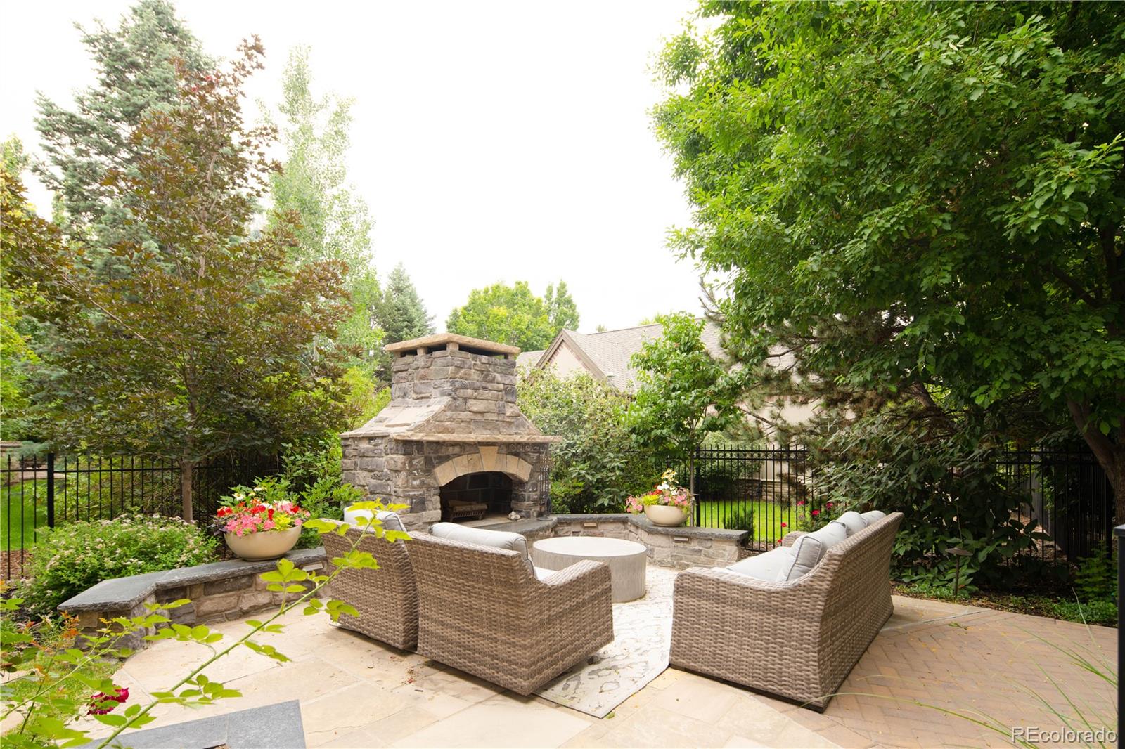 1 Ravenswood Road Cherry Hills Village, CO 80113 - Photo 34 of 40 a view of backyard with a garden and entertaining space