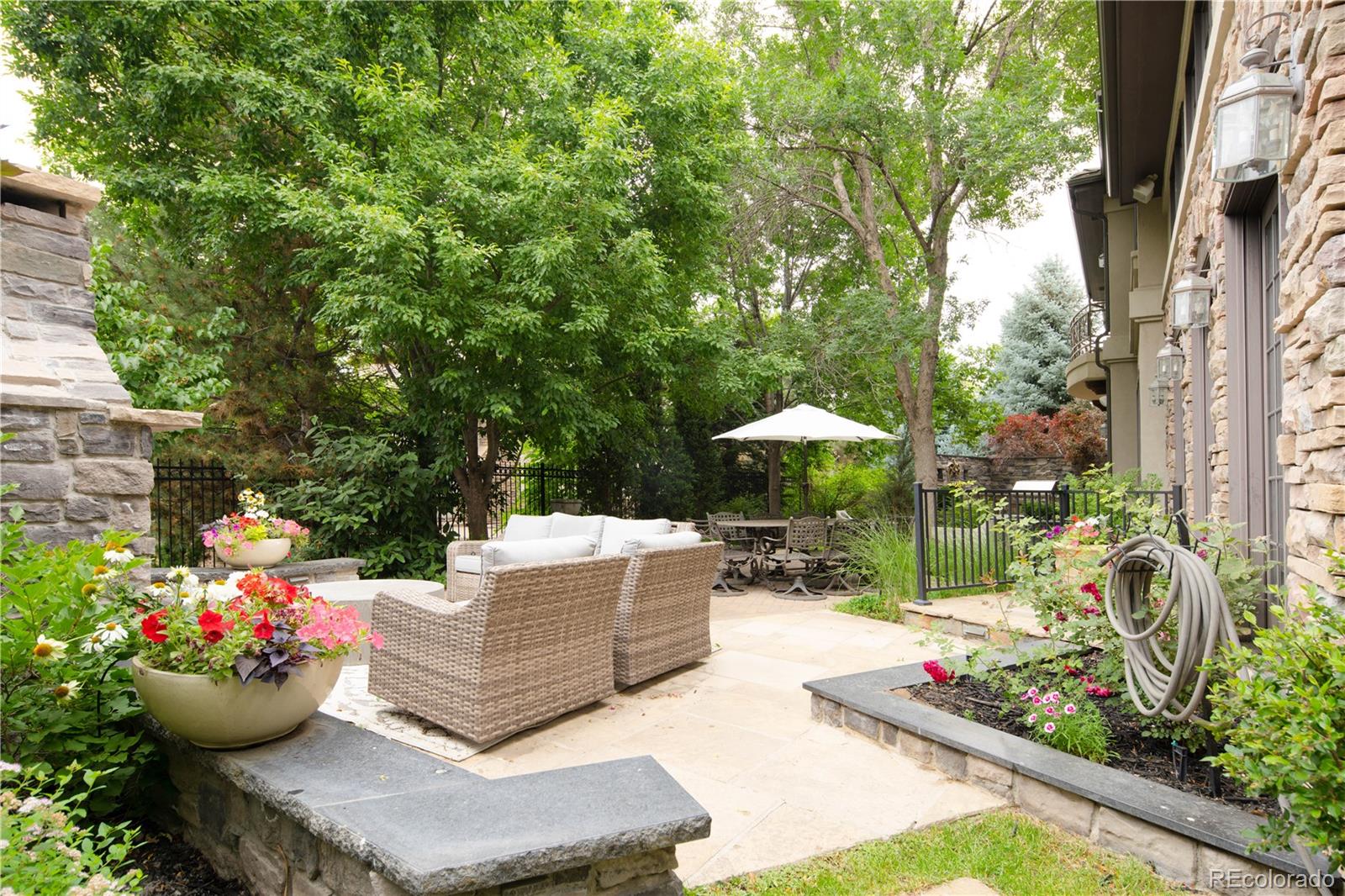 1 Ravenswood Road Cherry Hills Village, CO 80113 - Photo 38 of 40 a view of a garden filled with lots of potted plants