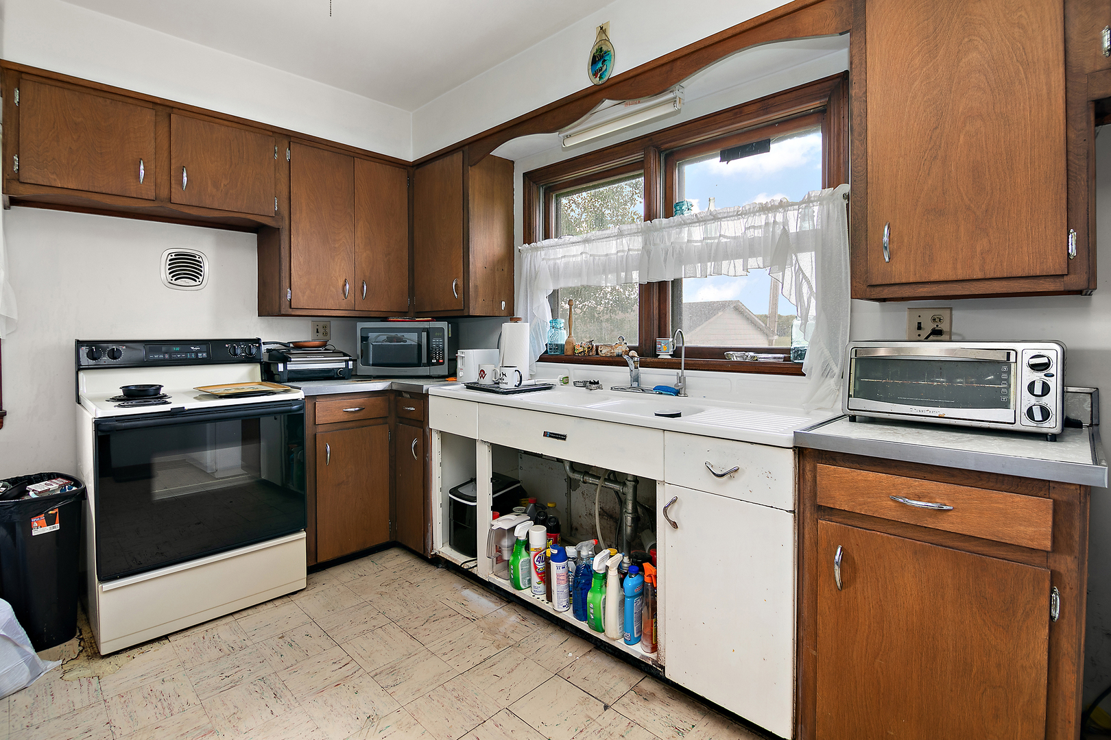 12710 West 1000N Road Herscher, IL 60941 - Photo 6 of 30 a kitchen with stainless steel appliances granite countertop a stove a sink and a microwave