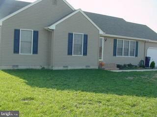 a view of front of house with a yard