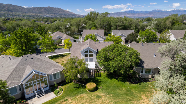 1417 Blacksmith Lane Draper, UT 84020 - Photo 55 of 57 Contemporary residence featuring a multi-gabled roofline and an upper-level arched window