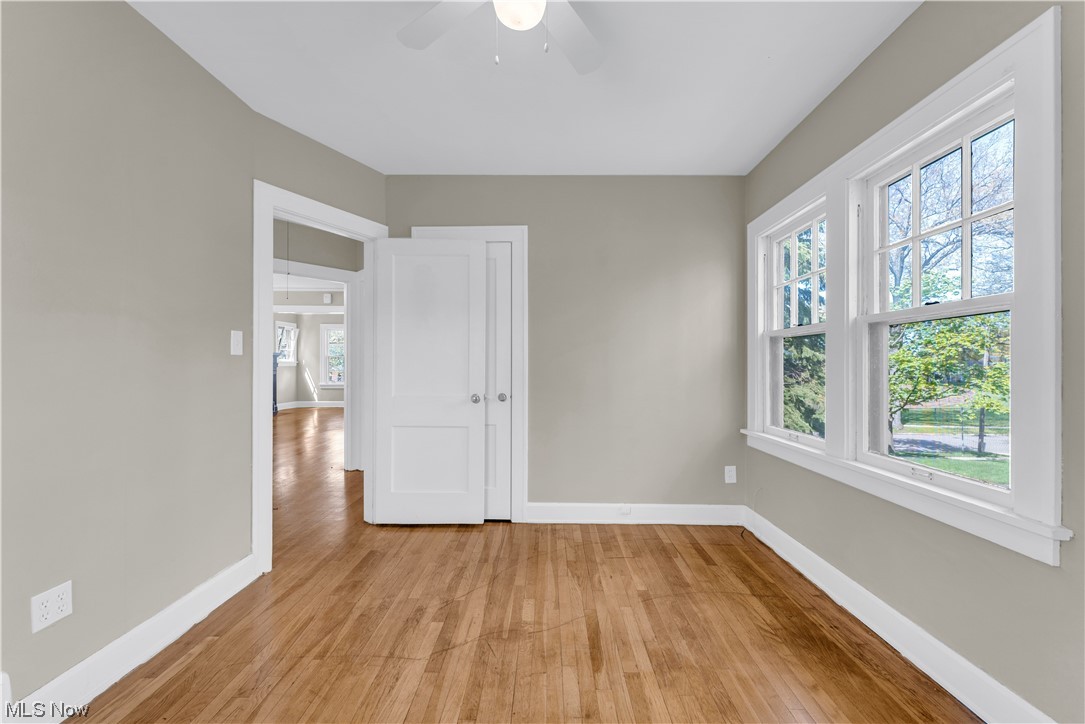 3609 Strandhill Road Shaker Heights, OH 44122 - Photo 6 of 47 Empty room with light hardwood / wood-style floors, ceiling fan, and a healthy amount of sunlight