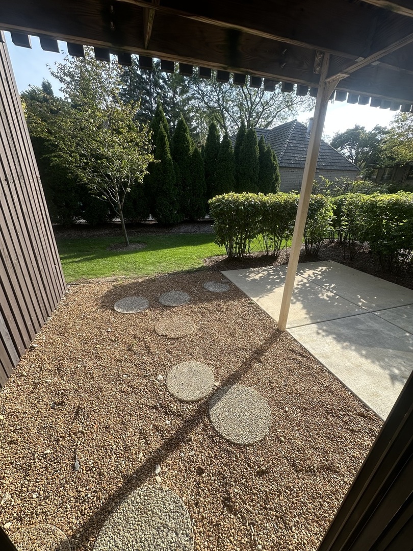 1721 Northfield Square, Unit B Northfield, IL 60093 - Photo 16 of 16 a view of a backyard with a garden and plants