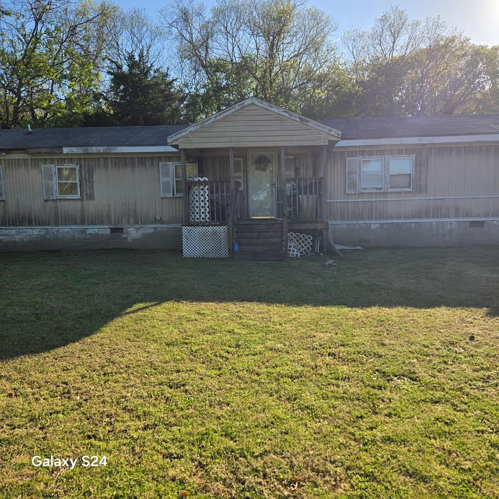 27282 Cheapside Road Cape Charles, VA 23310 - Photo 12 of 16 a front view of a house with garden
