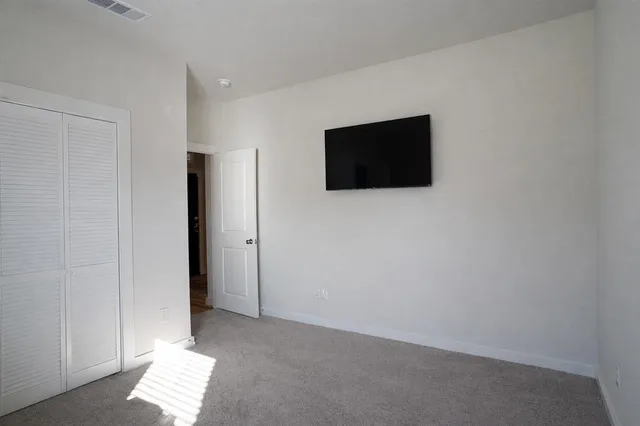 a view of a livingroom with a flat screen tv