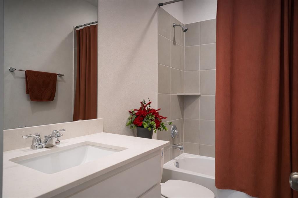 655 Scarlett Street Forney, TX 75126 - Photo 15 of 24 Full bath featuring shower / bath combination with curtain and vanity