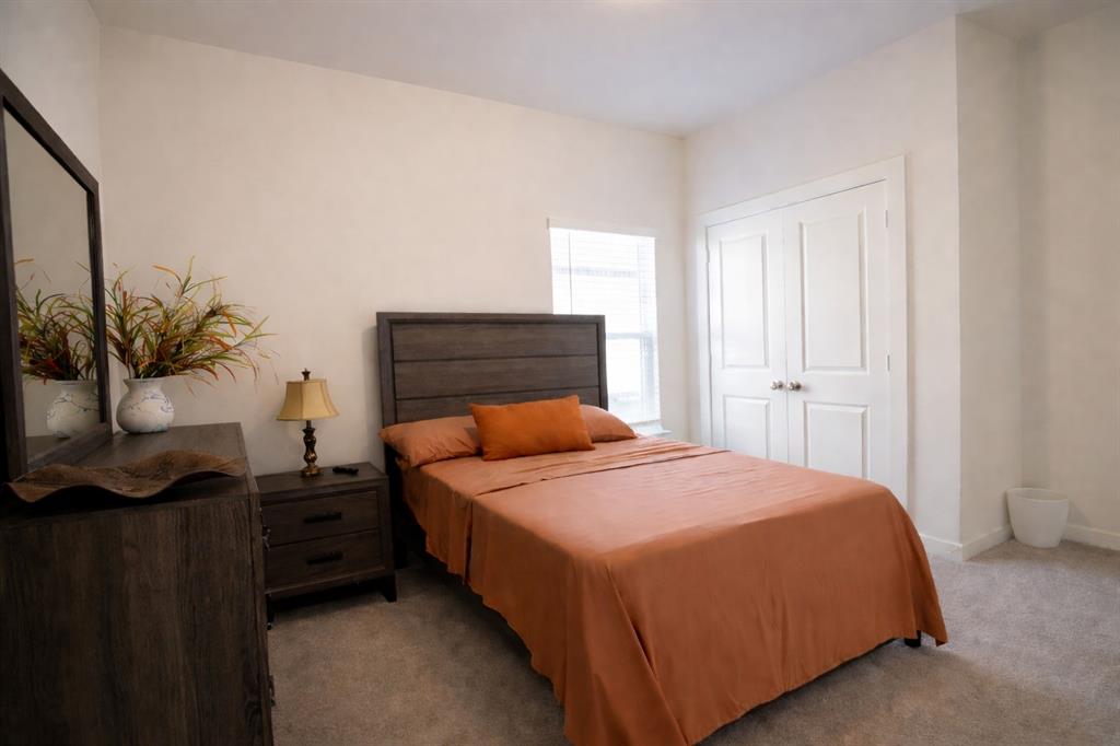 655 Scarlett Street Forney, TX 75126 - Photo 16 of 24 Carpeted bedroom with a closet