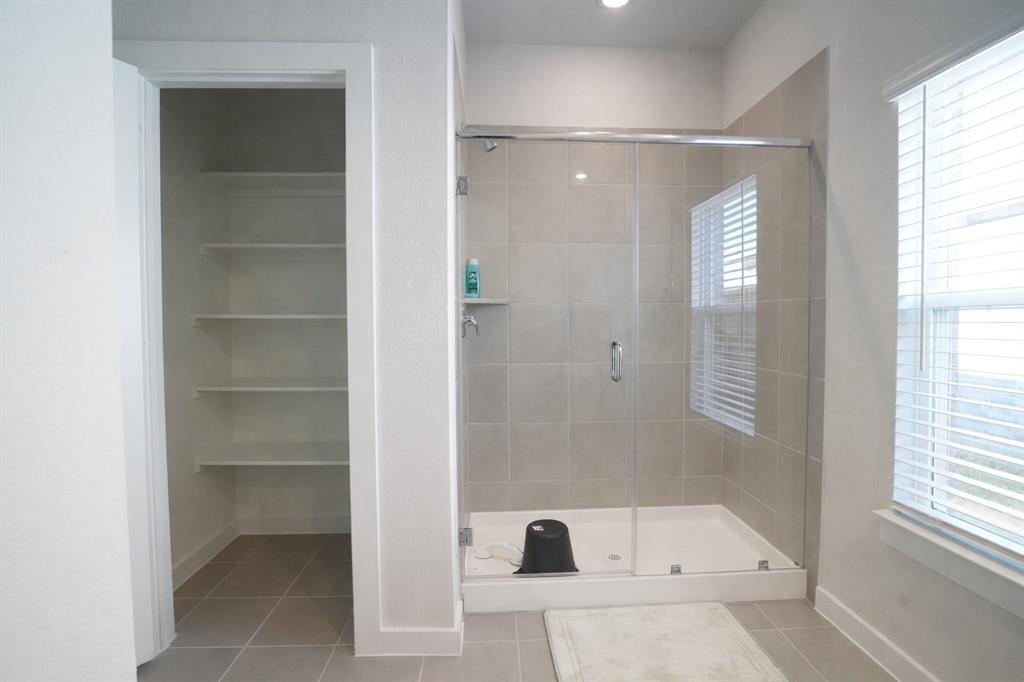 655 Scarlett Street Forney, TX 75126 - Photo 20 of 24 Full bathroom featuring light tile patterned floors and a shower stall