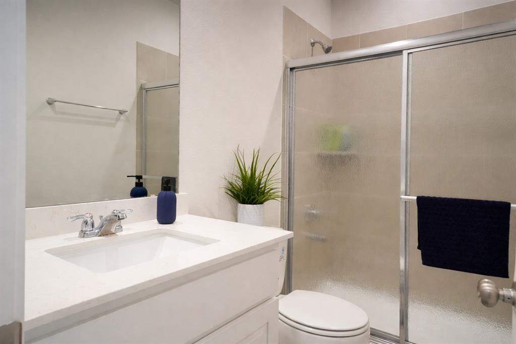 655 Scarlett Street Forney, TX 75126 - Photo 7 of 24 Bathroom featuring vanity and a shower stall