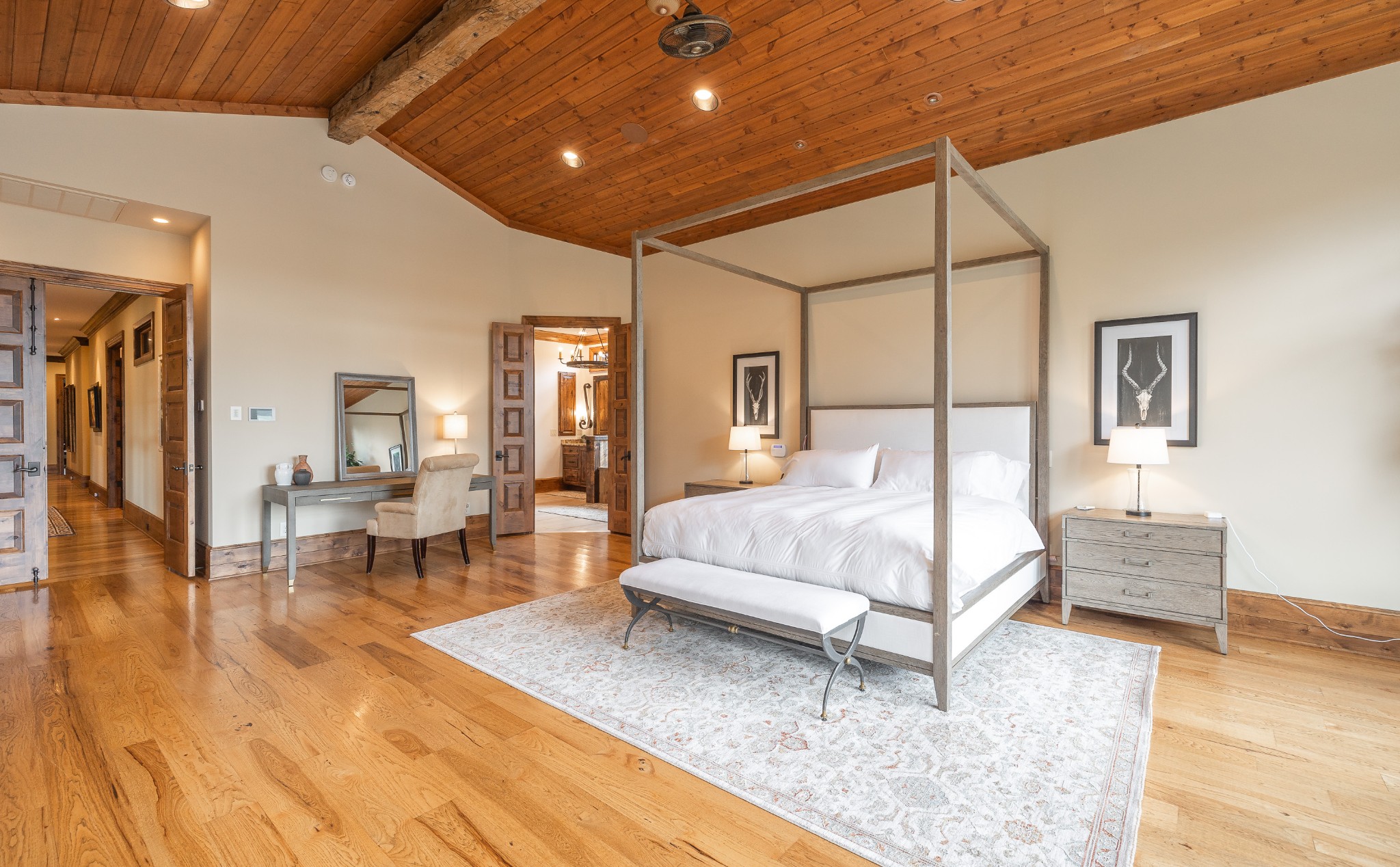 4750 Sharpsville Road Murfreesboro, TN 37130 - Photo 32 of 70 a spacious bedroom with a bed a table and painting on the wall