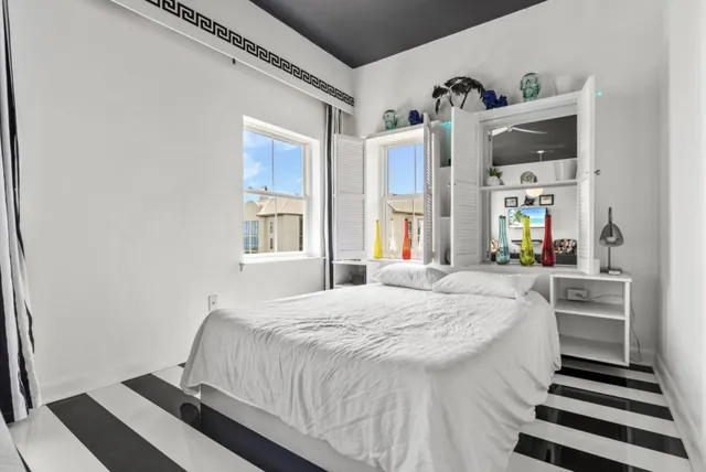 a bathroom with a toilet and a shower curtain