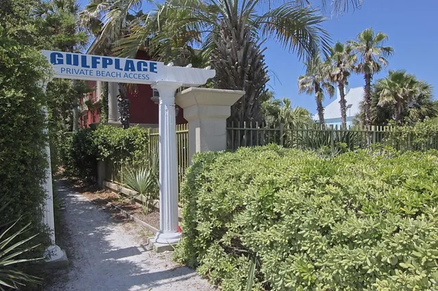 a park view with a bench and trees