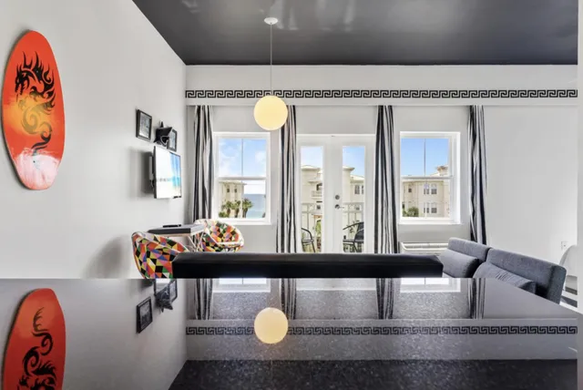 a bathroom with a sink mirror and vanity