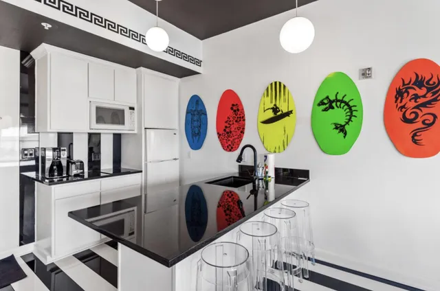 a view of a kitchen area with stainless steel appliances