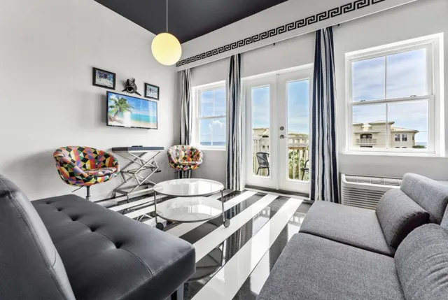 a living room with furniture and a table