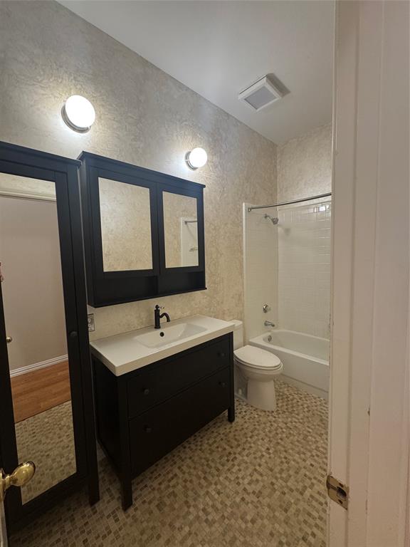 8109 Sebastian Frisco, TX 75035 - Photo 13 of 19 a bathroom with a toilet a sink and a mirror