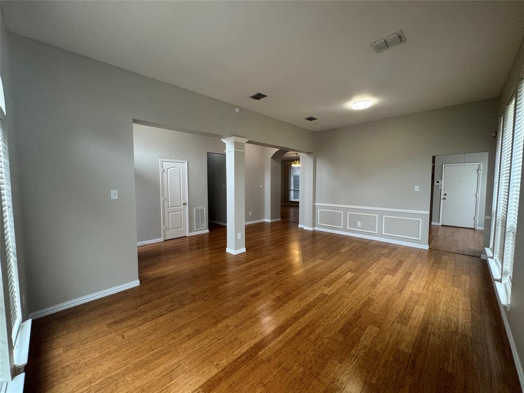 8109 Sebastian Frisco, TX 75035 - Photo 5 of 19 a view of an empty room with wooden floor