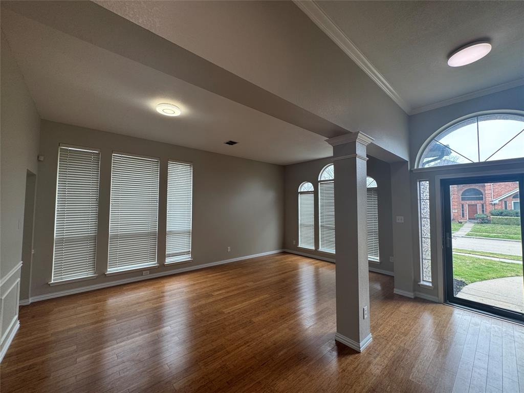 8109 Sebastian Frisco, TX 75035 - Photo 7 of 19 an empty room with wooden floor and windows