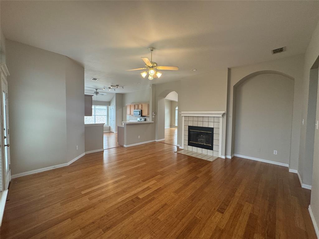 8109 Sebastian Frisco, TX 75035 - Photo 8 of 19 a view of an empty room with a fireplace and a window