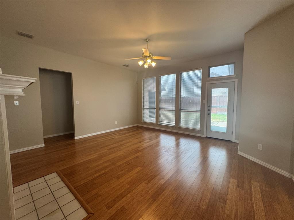 8109 Sebastian Frisco, TX 75035 - Photo 9 of 19 wooden floor in an empty room with a window