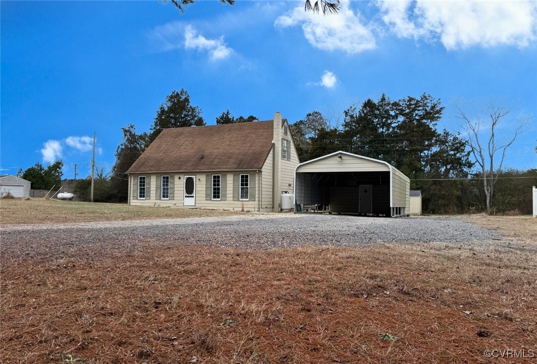 4210 Chesdin Boulevard Sutherland, VA 23885 - Photo 1 of 35 a front view of a house with a yard and garage