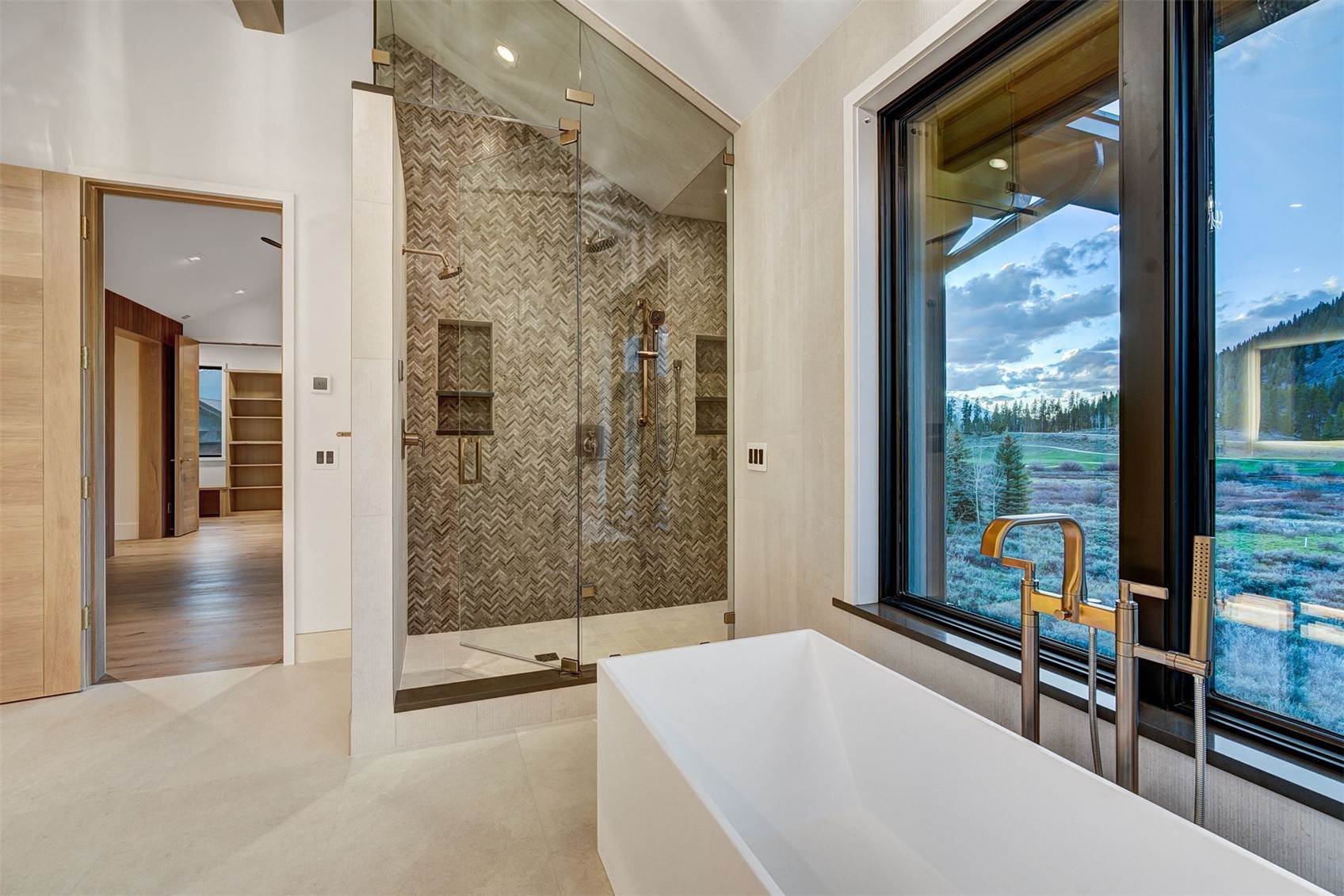 294 Gold Run Road Breckenridge, CO 80424 - Photo 39 of 49 a bathroom with a glass shower door and a large window